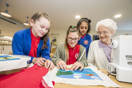 Resident Daphne Egan with pupils, from left, Sian Williams, 11, Mia Gardner, 10 and Maryam Khan, 10.